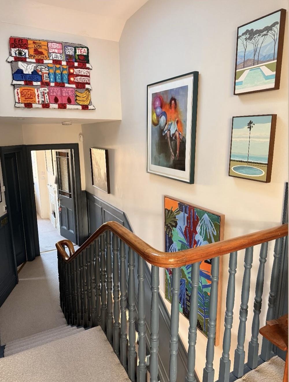 Staircase gallery wall with work by Asha Murray, Chloe Earley, Emma O'Hara and Michael Amery